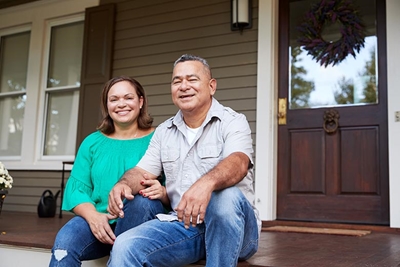 Austin couple sitting on their front porch